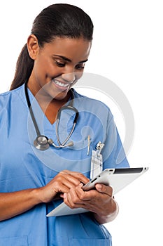 Female physician holding tablet pc