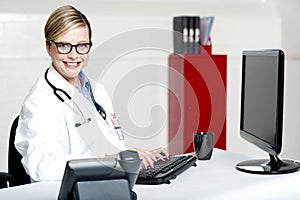 Female physician using computer