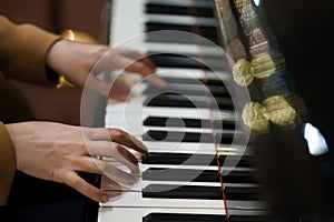 Female pianist plays the piano