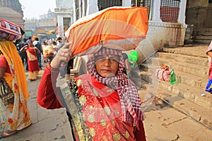 Female Pilgrim Pauses From Her Quest Along the Ganges River in India