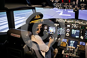 Female pilot the captain of the plane prepares for take-off in the plane cockpit.