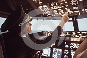 Female pilot captain prepares for take-off plane