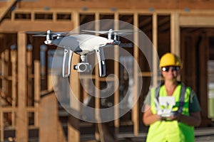 Female Pilot Flies Drone Quadcopter Inspecting Construction Site photo