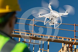 Female Pilot Flies Drone Quadcopter Inspecting Construction Site