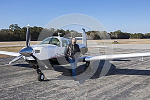 Female pilot with private plane