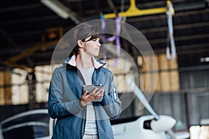 Female pilot using a digital tablet