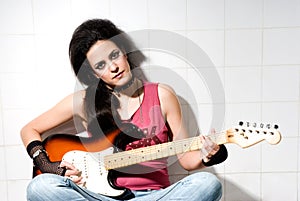 Female playing electric guitar