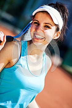 Female playing tennis