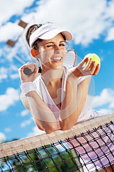 Female playing tennis