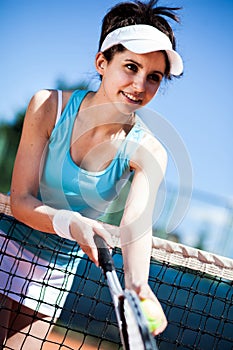 Female playing tennis