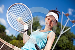 Female playing tennis