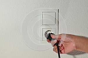 Female plugging in power cord