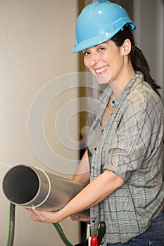 female plumber looking at camera