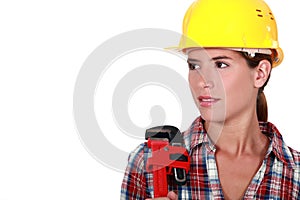 Female plumber with a wrench.