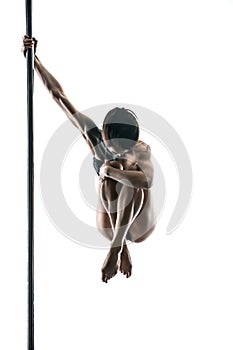 Female pole dancer with body-art on pylon