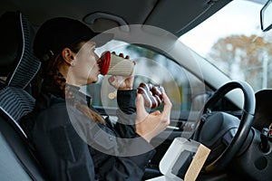 Female police officer having lunch during workday