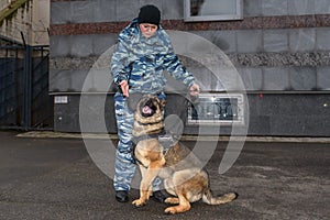 Female police officers with a trained dog. German shepherd police dog