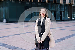Female portrait of a business woman wearing glasses at the business center