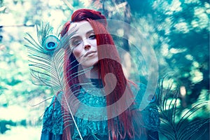 Female portrait with peacock feather on foreground. beauty makeup.