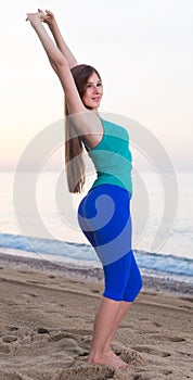 Female is posing on beach in her free time