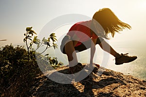 Female practicing yoga arm-balance