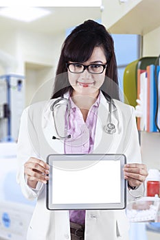 Female practitioner showing digital tablet 1