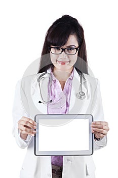 Female practitioner showing digital tablet