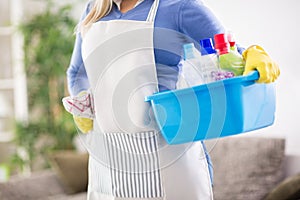 Female prepare chemical products for cleaning house