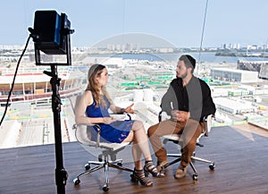 Female presenter asking a famous celebrity at tv studio