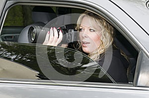 Female private investigator with camera