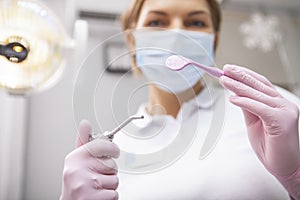 Female professional dentist working at dental clinic