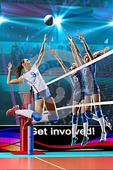 Female professional volleyball players in action on grand court