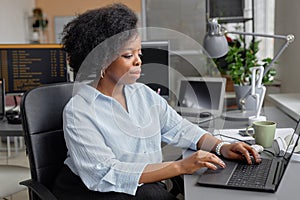 Female Programmer Coding at Workplace