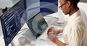 Female Programmer Developing Web Software On Computer