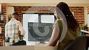 Female programmer using code to develop online app