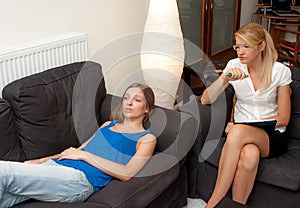 A female psychotherapist treats a female patient