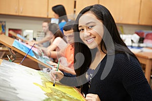 Female Pupil In High School Art Class