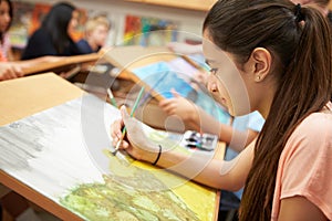 Female Pupil In High School Art Class