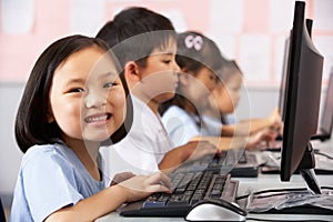 Female Pupil Using Keyboard During Computer Class