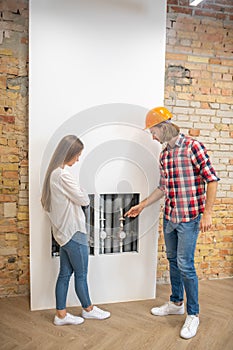 Female purchaser discussing construction issues with the worker