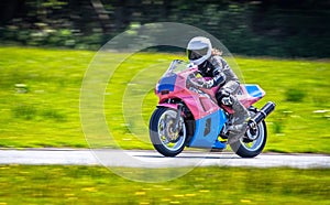 Female racer on motorbike