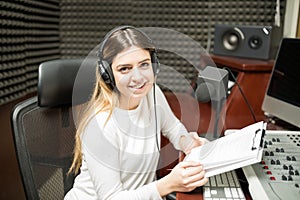 Female radio presenter moderating a show