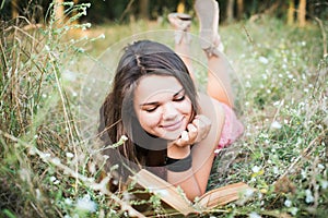 Female reading book in park