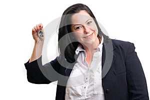 Female real-estate agent in formalwear presenting house keys