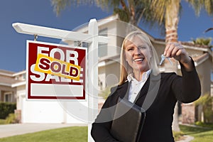 Female Real Estate Agent Handing Over the House Keys