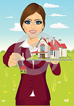 Female real estate agent holding the key