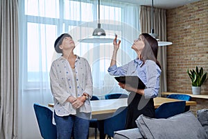 Female real estate agent showing apartment, house, to buyer, tenant