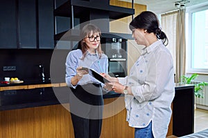 Female real estate agent showing apartment, house, to buyer, tenant