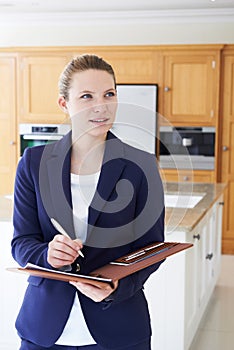 Female Realtor Looking Around Vacant New Property