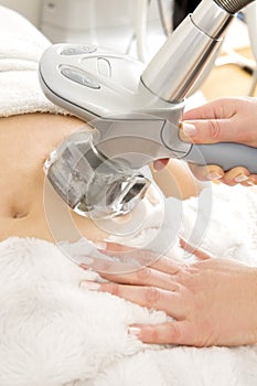 Female receive vacuum treatment at body clinic